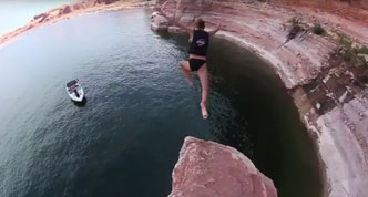 Person jumping in a lake